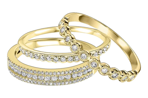 Trio of gold diamond rings with pavé and bezel-set accents