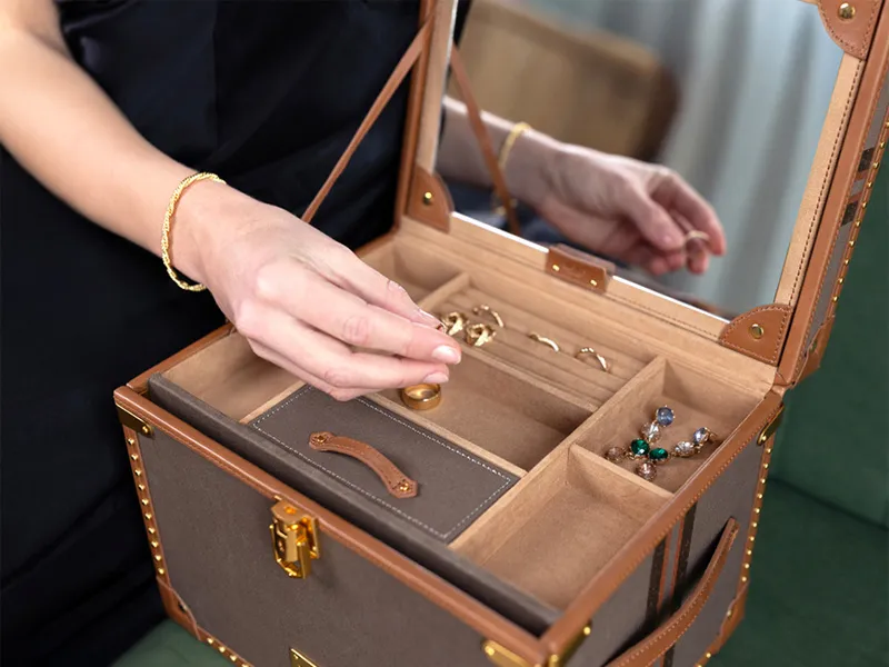 Hands opening WOLF Ballet blue velvet musical jewelry box