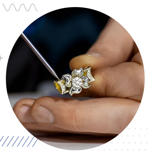 Skilled jeweler repairing ring with tools, chain, and workbench setup.